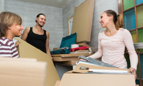 Professional movers carrying furniture during a residential relocation in Uxbridge