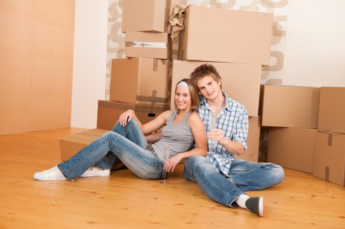 Moving team handling boxes safely with protective care