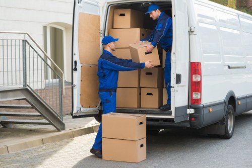 Van crew using protective packing and secure lifting methods