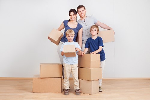 Professional house removalists in Uxbridge packing boxes for a home move