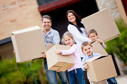 Experienced movers handling bulky household furniture during a Uxbridge relocation