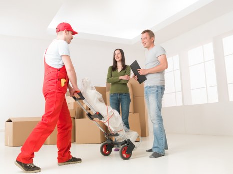 Careful unpacking services in Uxbridge arranging belongings in a new home