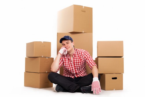 Family preparing boxes for a moving truck in Uxbridge